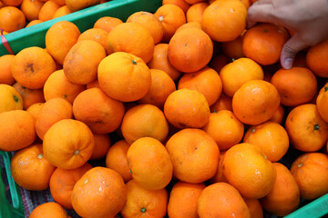 Photo of fresh oranges at the market, this fruit contains a lot of vitamin C