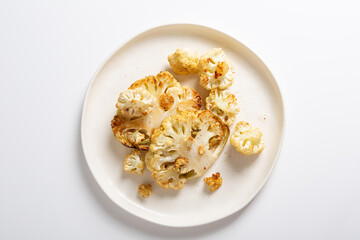 Overhead view  of roasted vegan steak cauliflowers healthy food