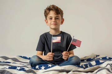 American boy holding little USA flags