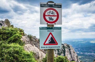 Warning sign in Montserrat mountain range near Barcelona, Catalonia, Spain