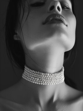 Black and white photograph of a girl with a choker.Minimal fashion concept