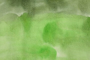 Ink watercolor hand drawn flow stain painting blot on wet paper texture background. Green color.