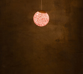 decorative red round chandelier hanging on the wall