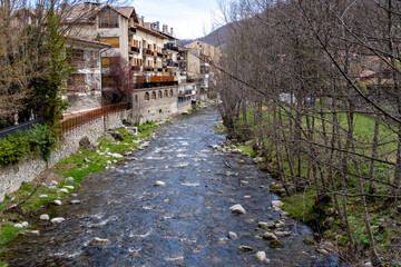 Fototapeta na wymiar River Ter as it passes by the houses in the town of Camprodon in Girona, Spain.