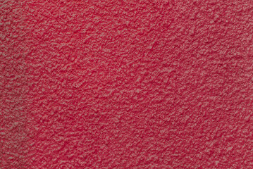 Rough wall plaster concrete crimson color solid surface stucco cement structure background texture