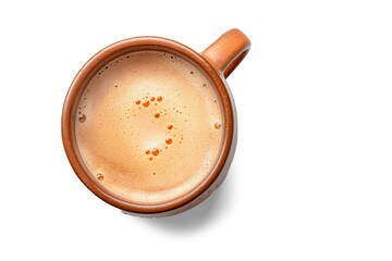 Eartyh Terracotta Ceramic coffe Mug with froth milk, top down view on white background