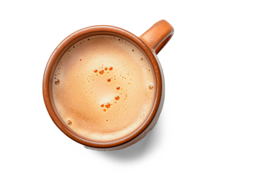 Eartyh Terracotta Ceramic coffe Mug with froth milk, top down view on white background