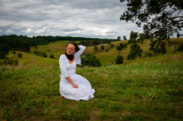 Landscape of summer nature. Beautiful girl at nature valley outdoor. Freedom lifestyle. Carpathians mountain girl. Woman in windy valley. Woman in the mountain valley. Copy space