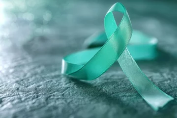 Poster A ribbon with a green ribbon is laying on a table © top images