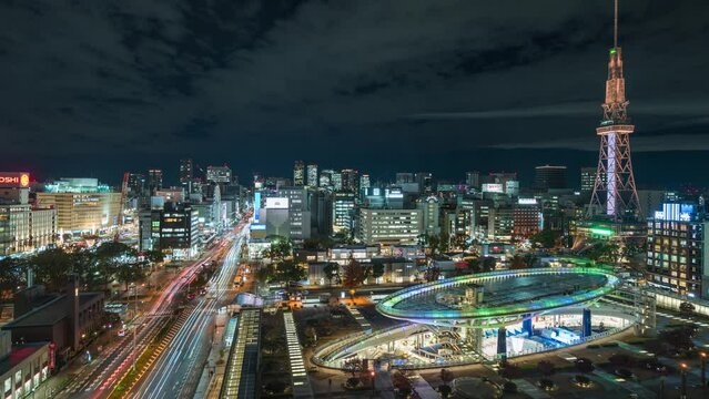 Timelapse view of the Sekae district with architectural landmark Nagoya Tower at night in Downtown Nagoya, Aichi Prefecture, Japan, zoom out.