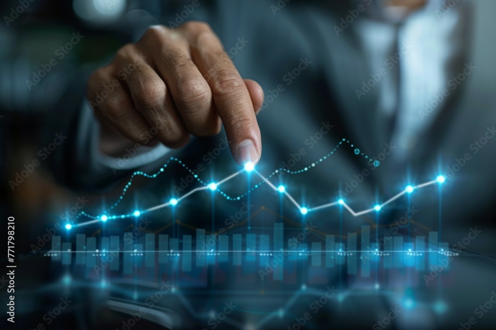 Poster a hand is pointing at a graph with a blue line