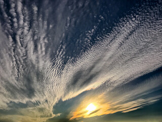 Sunset through high streaked clouds