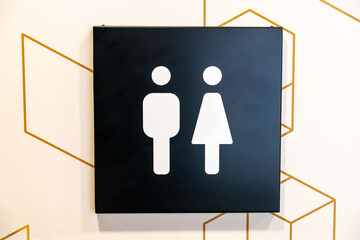 Gender Symbols on Restroom Sign with Hexagon Pattern