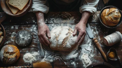 Photo sur Plexiglas Pain top view of baker's hands baking bread on table