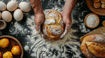 Photo sur Aluminium Pain top view of baker's hands baking bread on table