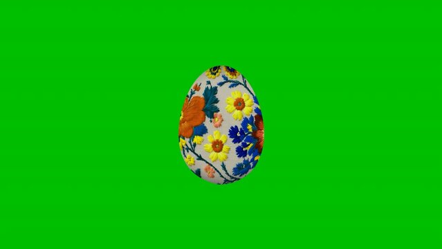 An Easter egg embellished with embroidery, isolated on a green screen background, in 4K resolution