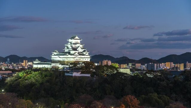 Dusk to night timelapse view of Himeji Castle during fall season, Hyogo Prefecture, Japan. 
