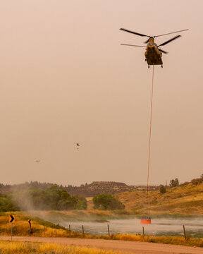 This is a CH-47 Chinook helicopter being used to fight a wildfire.