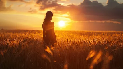 Rolgordijnen Woman in a Dress Standing in a Wheat Field During Sunset © Art by Afaq