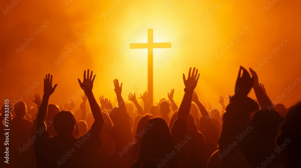 Wall mural Christian worshipers raising hands up in the air in front of the cross