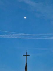 moon, aircraft contrails over cross