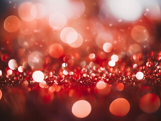 Red circular bokeh adds sparkle to a filtered background of defocused glitter.