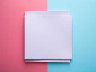 Top view of blue and white square paper on pink background. - obrazy, fototapety, plakaty