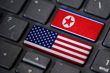 USA and North Korea flags on computer keyboard
