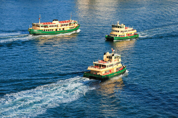 Ferries on Sydney Harbour.  Commercial tour boats travelling between north shore Sydney and...