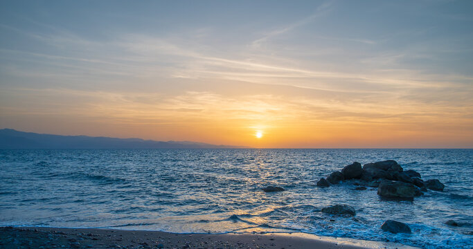 Bright sun at sunset. Mediterranean Sea