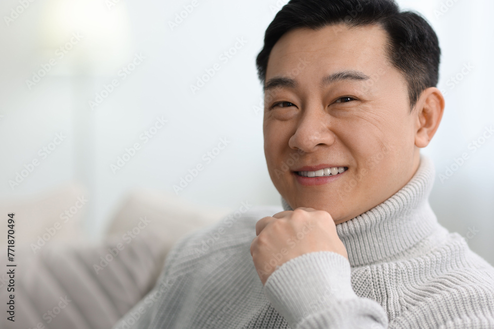 Canvas Prints Portrait of smiling man on blurred background. Space for text