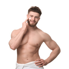 Fototapeta premium Handsome man applying moisturizing cream onto his face on white background