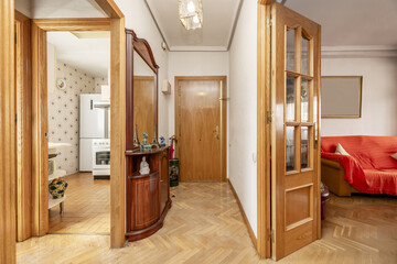 Entrance hall and distributor of a home with oak parquet floors and doors of the same wood to other...