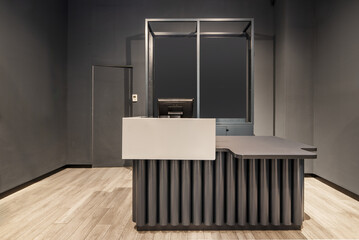 Empty clothing store counter with cash register