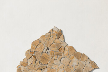 Stone sample rough mountain rock solid object white light wall pattern background empty space blank abstract facade