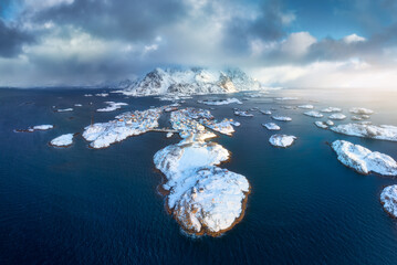 Aerial view of snowy Lofoten islands, Norway in winter at sunset