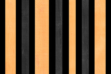 Yellow light vertical lines stripe wooden fence board black background isolated plank object