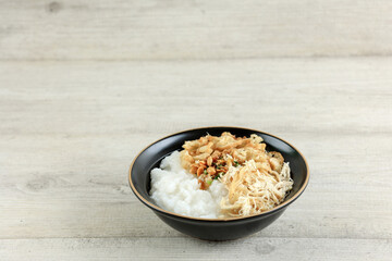 Bubur Ayam or Indonesian Rice Porridge with Shredded Chicken.