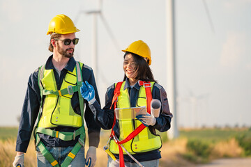 Engineers are working with wind turbines, Green ecological power energy generation, and sustainable windmill field farms. Alternative renewable energy for clean energy concept. - 771911452