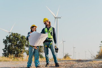 Engineers are working with wind turbines, Green ecological power energy generation, and sustainable windmill field farms. Alternative renewable energy for clean energy concept. - 771911492