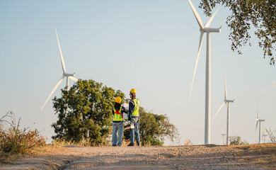 Engineers are working with wind turbines, Green ecological power energy generation, and sustainable windmill field farms. Alternative renewable energy for clean energy concept. - 771911493