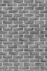 Vertical grey brickwork masonry brick wall texture background facade backdrop