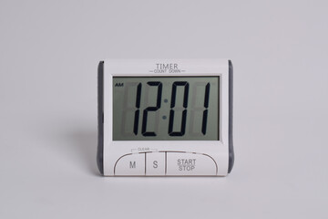 Digital kitchen timer on white background. Mini Digital counter timer kitchen alarm clock, count down clock for cooking