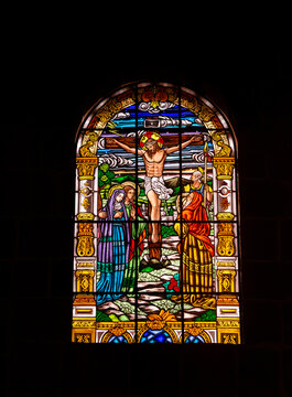 Colorful stained glass window depicting a religious scene in Barichara, Santander, Colombia