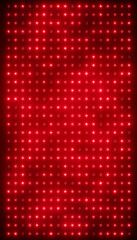 Illustation of an abstract glowing red LED wall with bright light bulbs - abstract background.