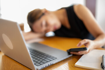 Overworked Businesswoman Asleep at Her Desk