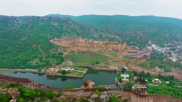 Aerial shot of the medieval Amber Palace on a cloudy day in in Amer, Jaipur, Rajasthan, India