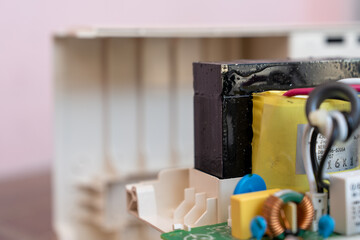 Electrical transformer in UPS, power backup battery for personal computers. Electronic waste.