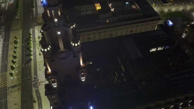 Hyperlapse drone footage of the Royal Liver Building illuminated at night in Liverpool, England, UK