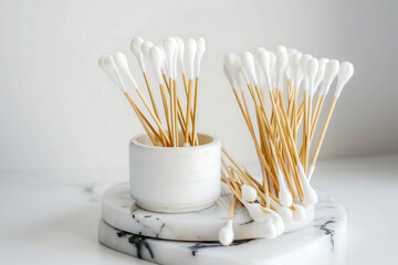Cotton swabs on marble base for the ears close-up isolated